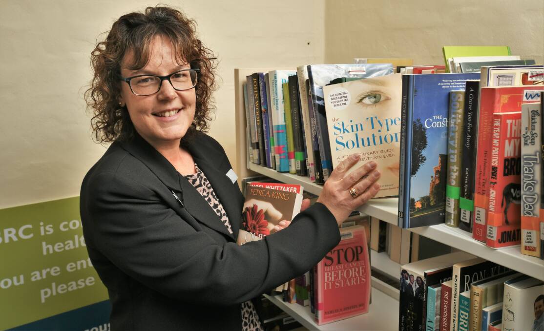 LIBRARY BOOKS: Lisa Hollaway, from library services, preparing for their monthly book sale this Friday. Photo:CHRIS SEABROOK 053121cbooks1