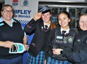 Left: Senior Constable Arna Martin with year 11 students, Annie Craig and Arissa Meacham and Senior Constable Rachael Joyce, from Chifley Police District. Photo: CHRIS SEABROOK 080922career10