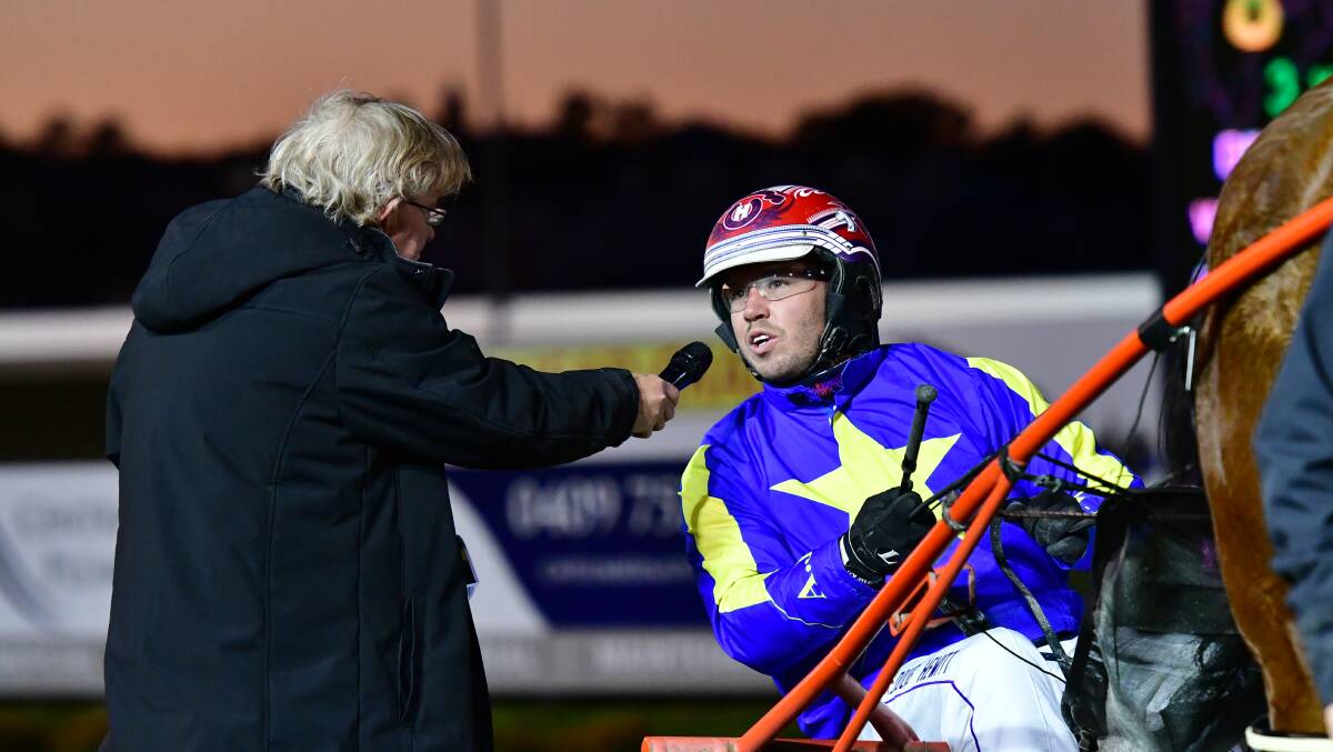Doug Hewitt speaks with Farren Hotham after a driving win in the opening race of Wednesday night's meeting. Photo: BRADLEY JURD
