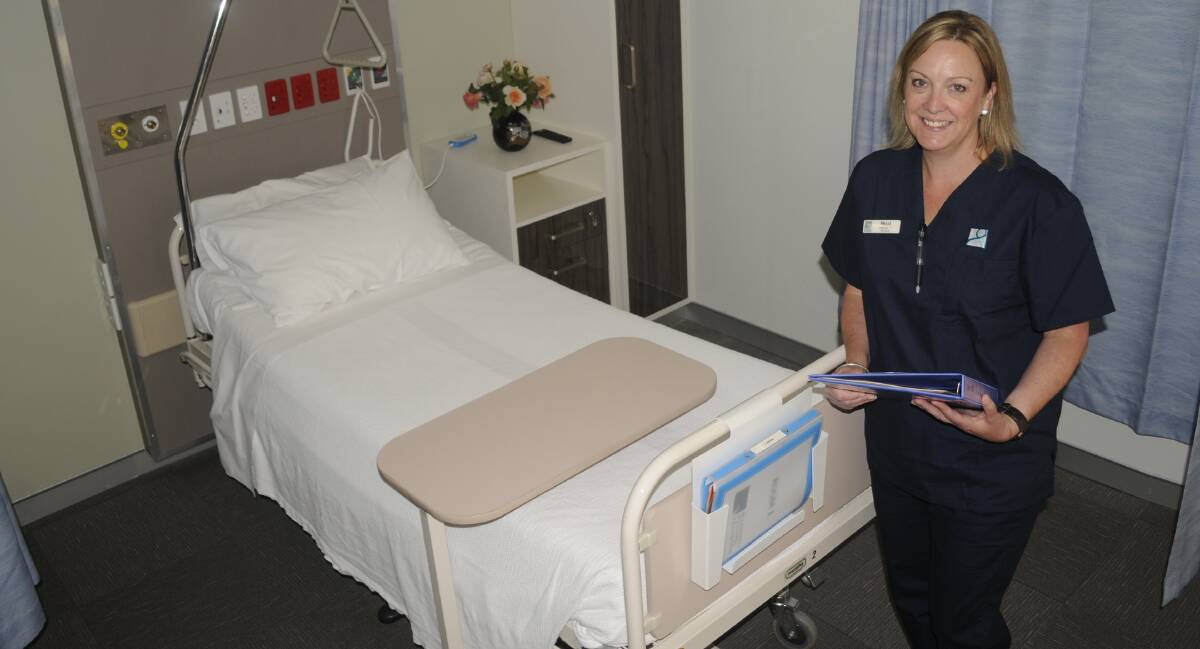 BRAND NEW: Bathurst Private Hospital director of nursing Nikki Taylor with one of the new beds. Photo: CHRIS SEABROOK 110717cbeds1