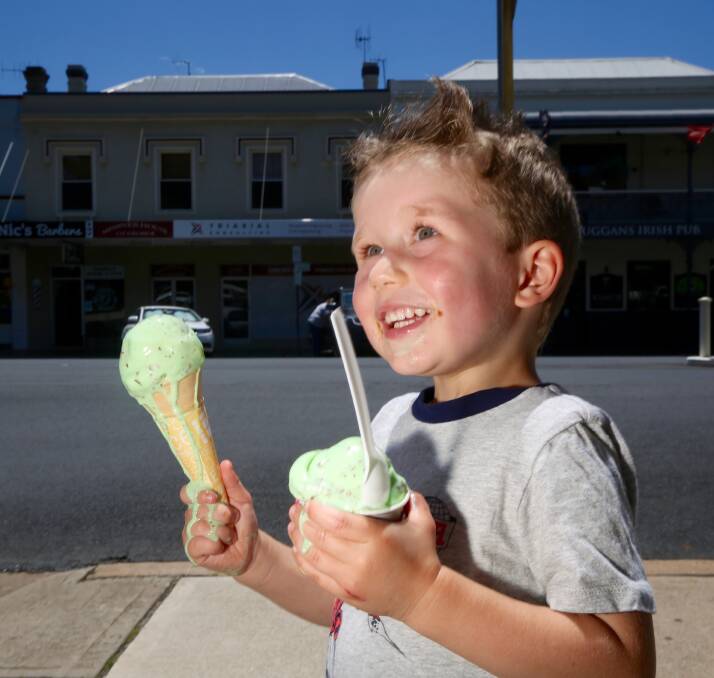 HOT: Four-year-old Mason Watts cooled off on Thursday with an ice cream from Annies Old Fashioned Ice Cream Parlour. Photo: PHIL BLATCH
