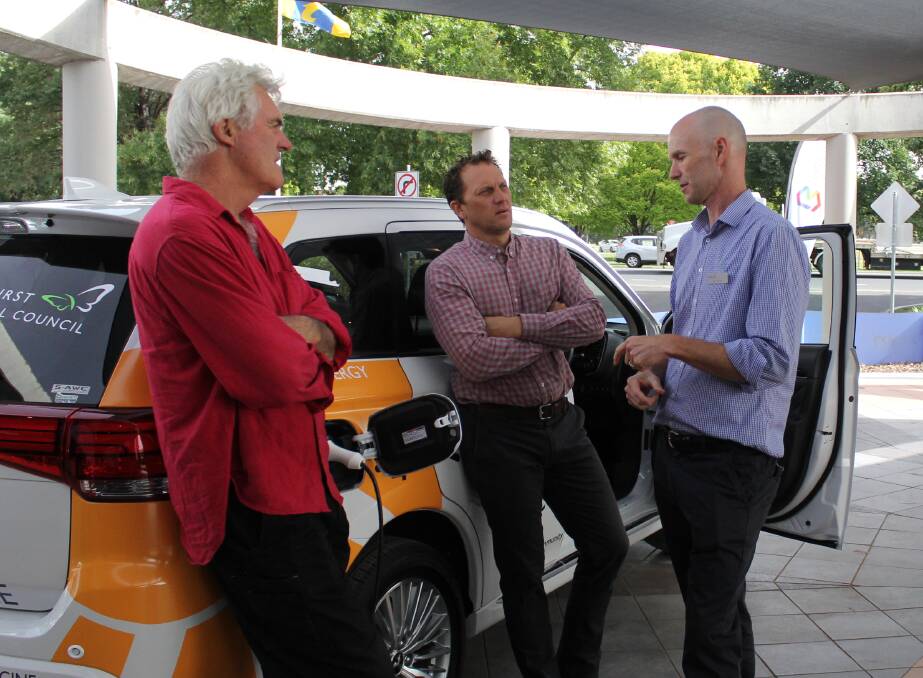 Bathurst councillors John Fry (left) and Jess Jennings (centre) discuss the council's new plug-in hybrid vehicle with environental officer Joel Little