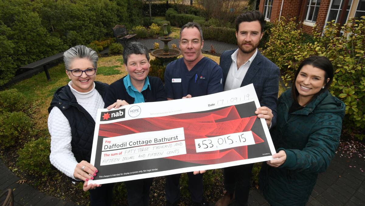 HELP: Mandy Wilding from the Daffodil Cottage Advisory Committee, oncology pharmacist Victoria Stevens and acting nurse unit manager Brenden Stapleton with Ben Fry and Melissa Hodges from Hope Charitable Group. Photo: CHRIS SEABROOK 091719cheque