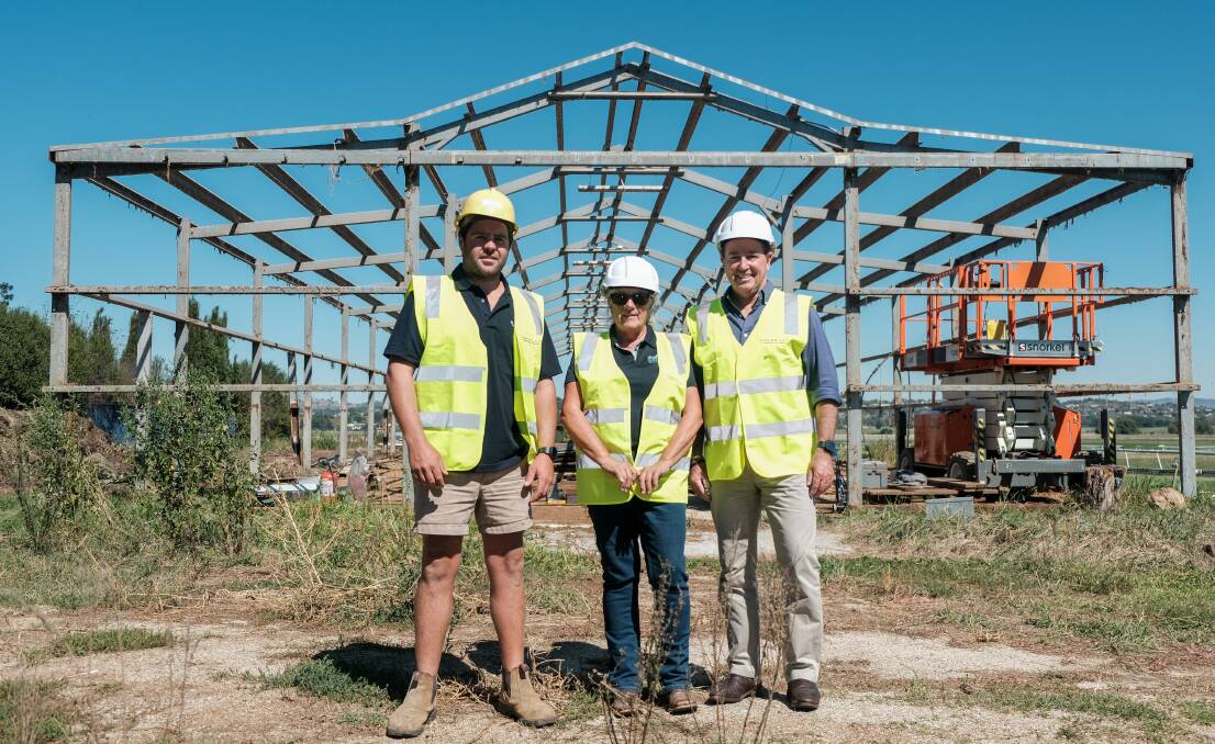 Mark Donnelly of Donnelly Construction Group, Bathurst Thoroughbred Racing Club acting manager Lisa Pierce and Bathurst MP Paul Toole outside the barn that will be pulled down by the end of next week. Picture by James Arrow.