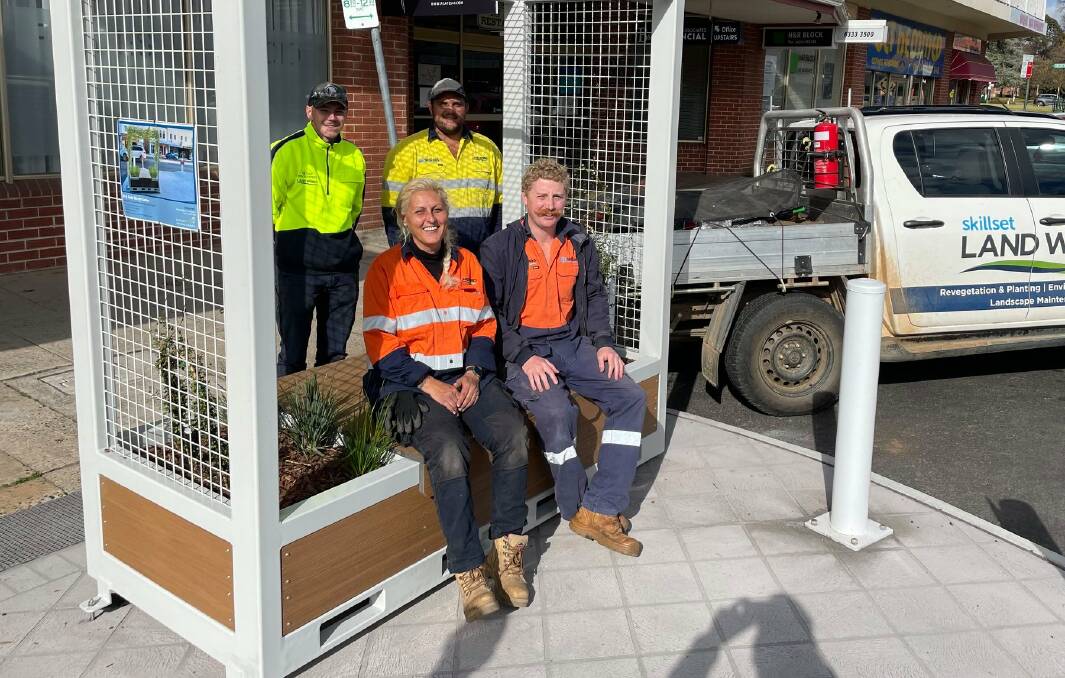 NEW LOOK: The team from Skillset Landworks with the new garden structure on George Street. Photo: CONTRIBUTED