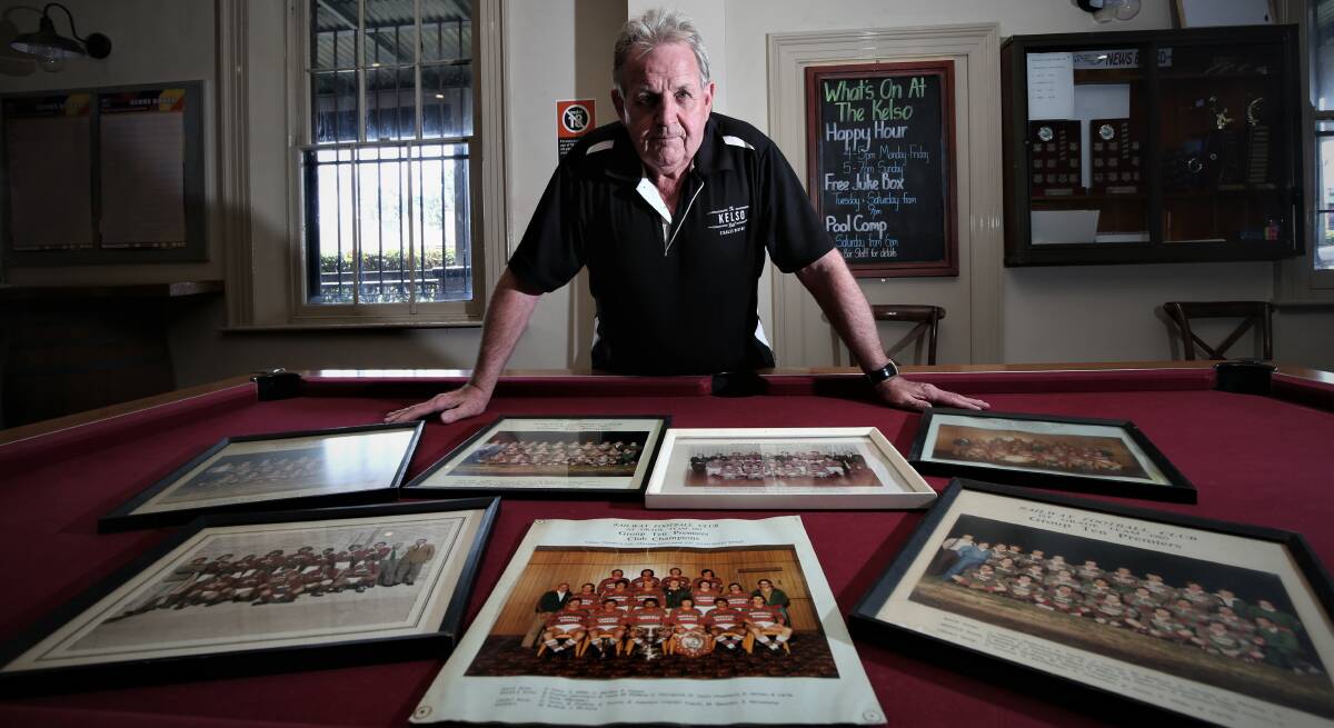 FLASHBACK: Robert Taylor with a collection of former Railway team photos that will be on display at the clubs 40 year anniversary for its 1981 grand final premiership latter this year. Photo: PHIL BLATCH 