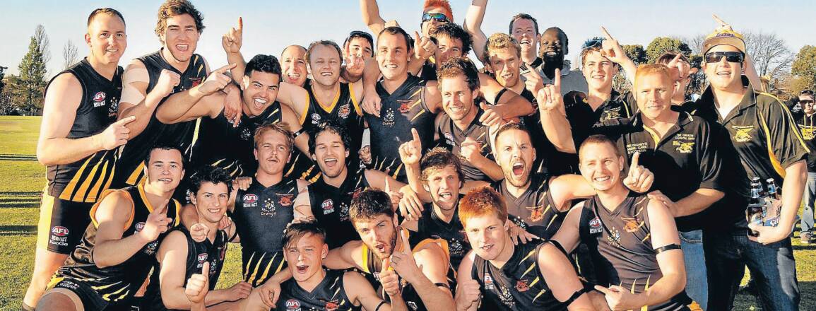 The Orange Tigers celebrate winning the 2013 Central West AFL grand final. 