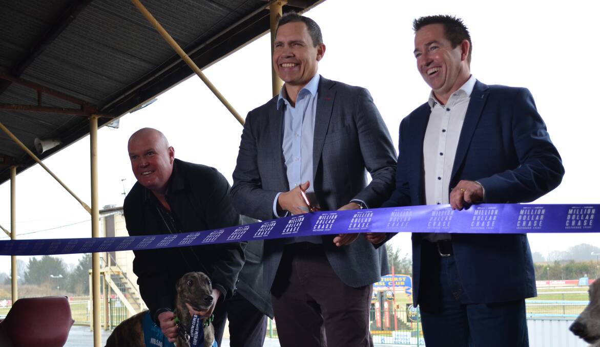 LAUNCH: Bathurst Greyhound Racing Club track manager Jason Lyne and Arnie, pictured with Greyhound Racing NSW CEO Tony Mestrov and Minister for Racing Paul Toole, at Kennerson Park on Friday. Photo: ANYA WHITELAW