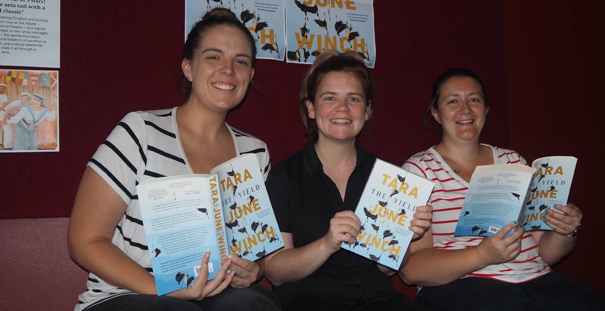 BOOKED IN: Bathurst Memorial Entertainment Centre staff Amy Church, Meg French and Louise Hoskin with copies of 'The Yield'. Photo: SAM BOLT