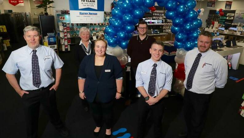 The team at Harvey Norman prior to its move to its current site in Bathurst. Owner Gerry Harvey was once a student at All Saints' College Bathurst. Picture by Chris Seabrook