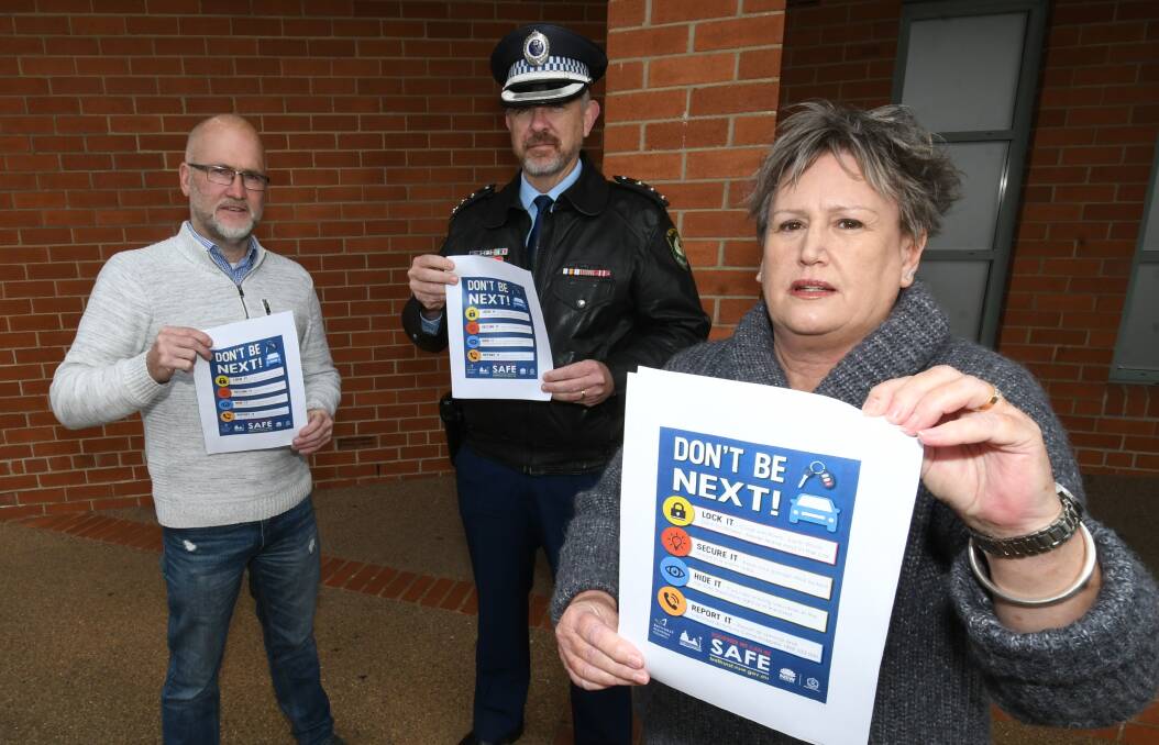SECURE YOUR CARS: Bathurst deputy mayor Ian North, Police Inspector David Abercrombie and councillor Jacqui Rudge launch a campaign urging residents to secure their cars. Photo: CHRIS SEABROOK 071420ccartheft1
