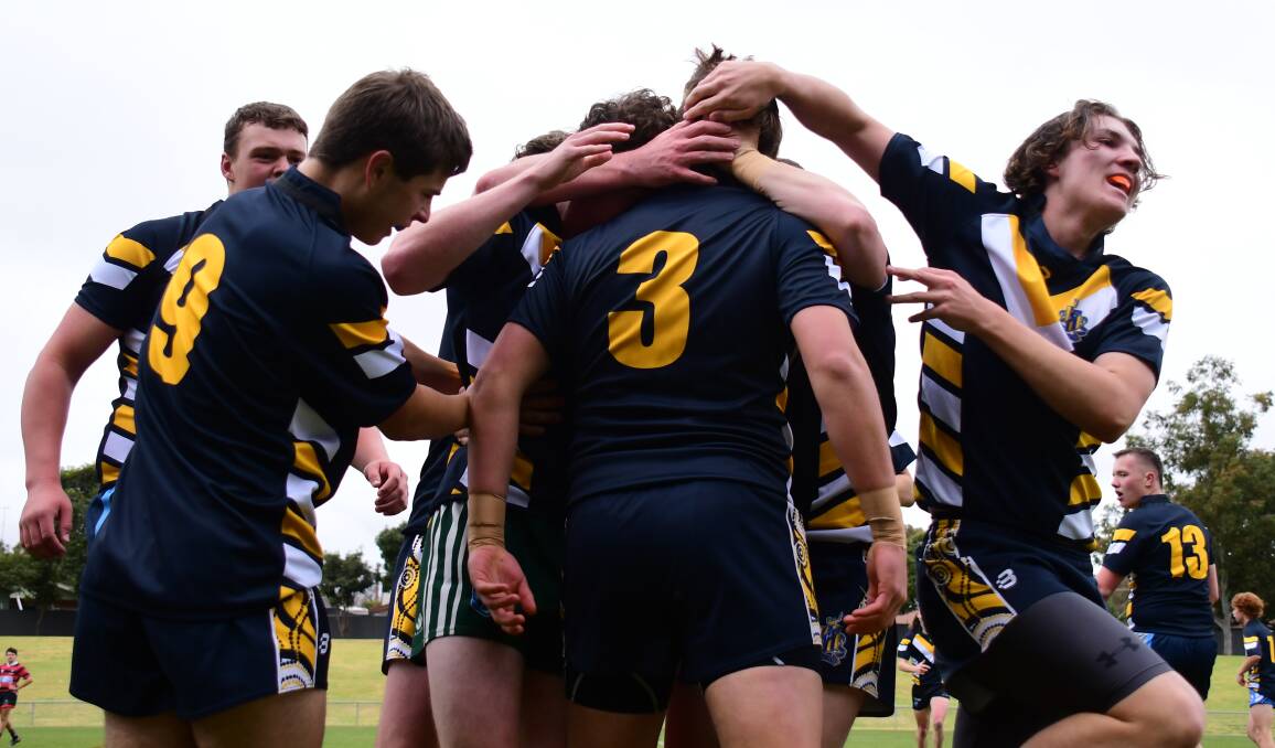 DEFEAT: Bathurst High Campus celebrate after scoring a try in its 20-8 loss to Dubbo on Friday. Photo: AMY McINTYRE 