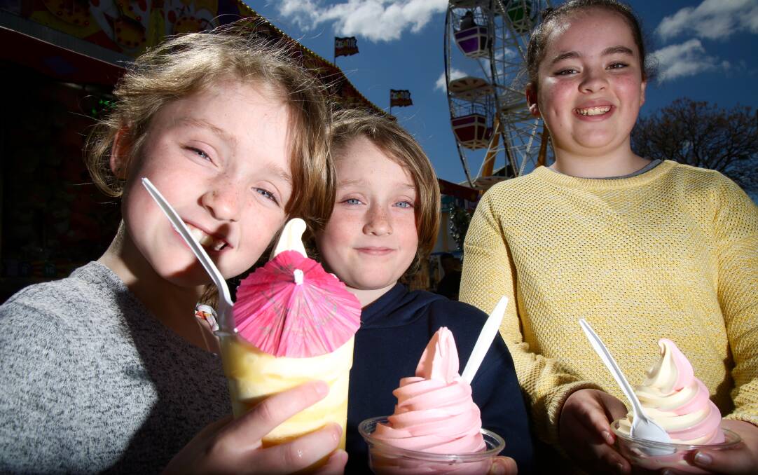 A FUN TIME: Willow and Faith Evans, with Lauren Foster, at the Bathurst Fun Fair on Saturday. Photo: PHIL BLATCH