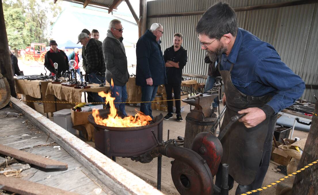 SNAPSHOT: Blacksmith Wayne Wagstaff, from Windsor, giving a demonstration on blacksmithing at the Heritage Trades Trail on Sunday. 