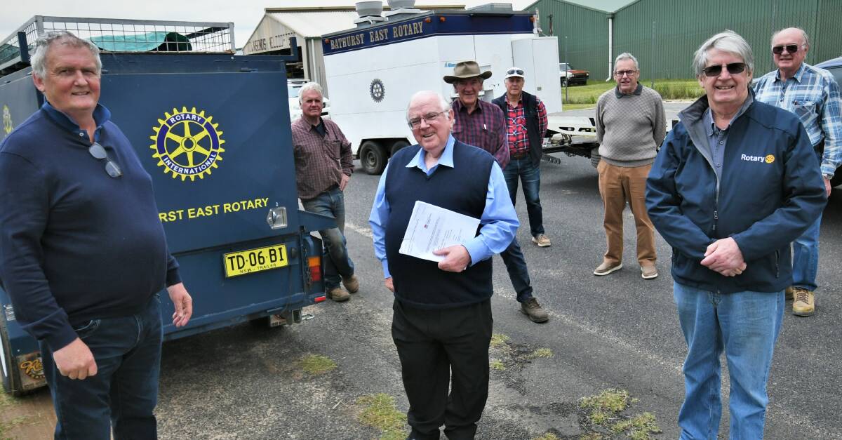 HANDOVER OF ASSETS: Front: Bathurst Rotary Club president Jeff Muir, last Bathurst East Rotary president Tony Pollard and Rotary District 9705 area governor Doug Kinlyside, with fellow Rotary members. Photo: CHRIS SEABROOK 