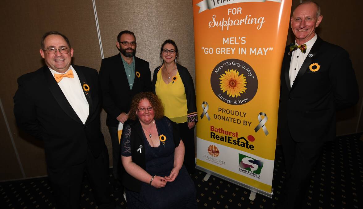 FUNDRAISERS: Melissa Johnson (centre) with Steve Semmens, Peter Johnson, Sharyn Semmens and Steve Harper at last year's Mel's "Go Grey in May". Photo: CHRIS SEABROOK