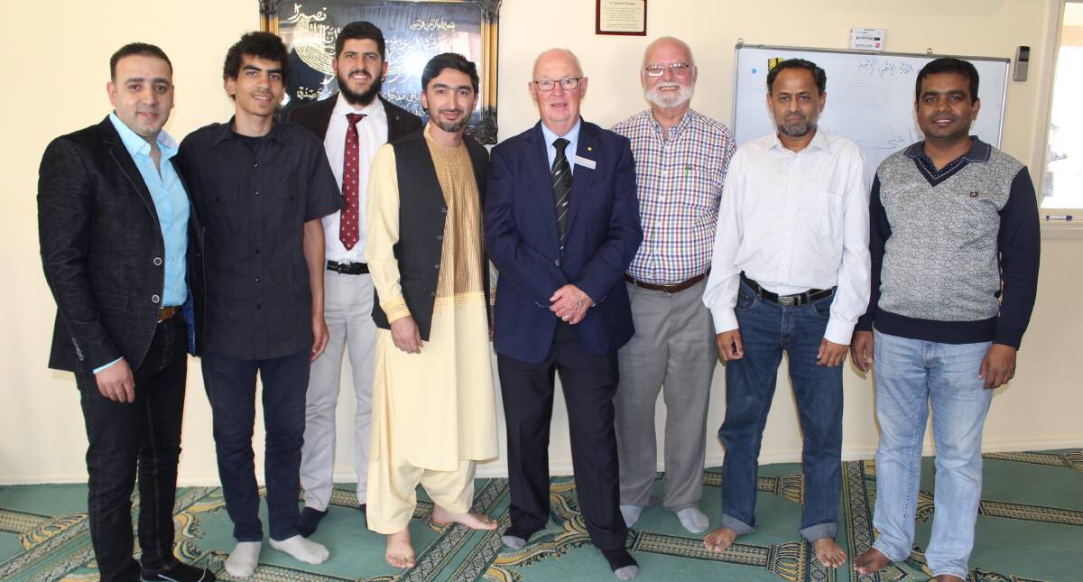 Members of the Bathurst Muslim community with Bathurst mayor Graeme Hanger (centre). Photo: BRADLEY JURD