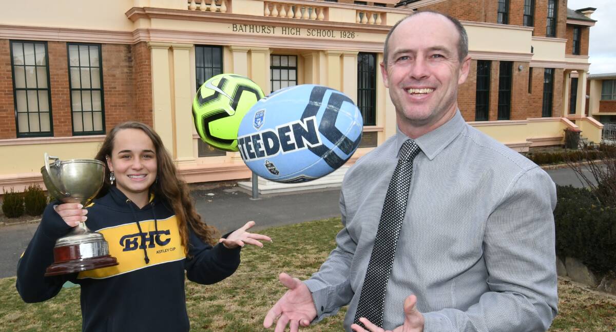 Year 11 girls' soccer player Kacey Fox, with Bathurst High Campus principal Ken Barwick ahead of the second round of the 2019 Astley Cup. Photo:CHRIS SEABROOK 062519cup1