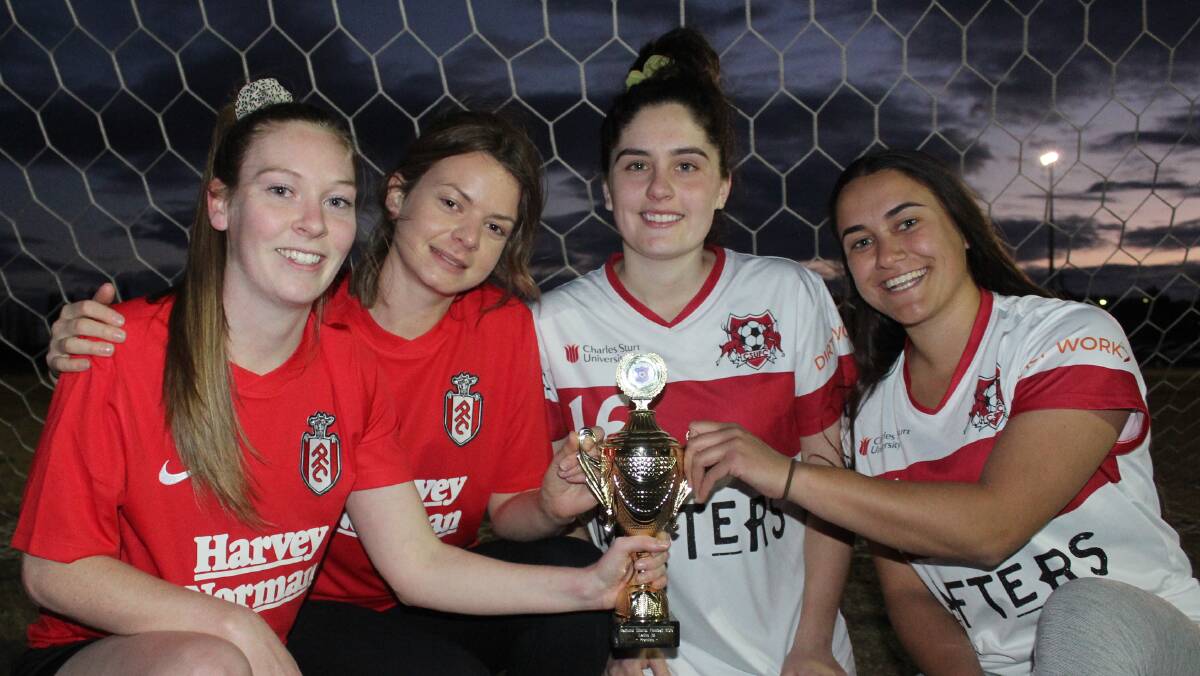GAME ON: Panorama players Emily Cochrane and Phoebe Rhodes, with CSU footballers Grace Clarke and Minna Annand ahead of Sunday's Bathurst District Football women's grand final. Photo: BRADLEY JURD