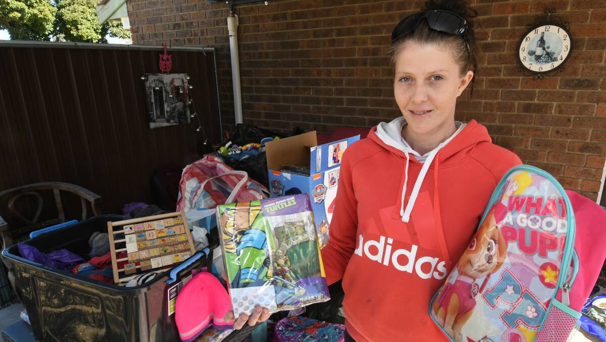 FIRE APPEAL: Mandy O'Dea with some of the items donated to help Emily Holder and her family. Photo: CHRIS SEABROOK 080719cfappeal