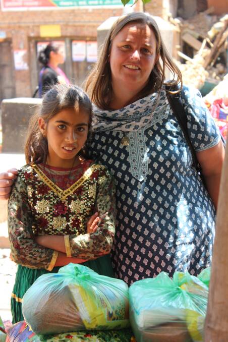 Bathursts Rebecca Ordish with then 11-year-old Laxmi in Nepal following an earthquake in 2015.