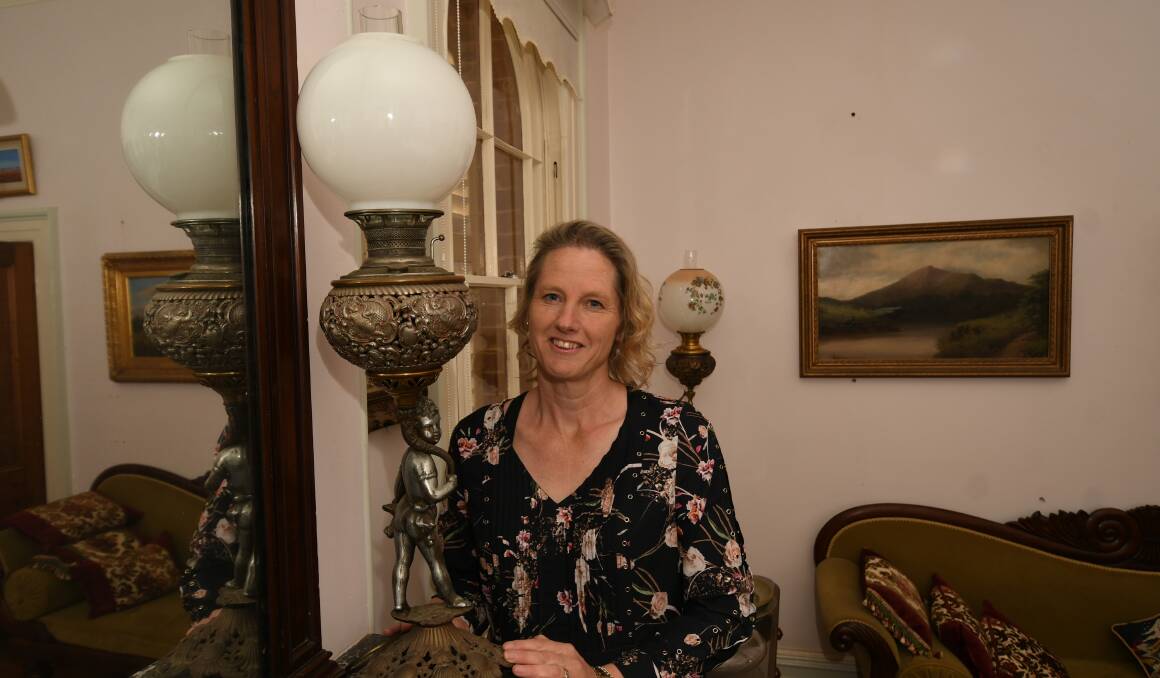 LAMPS ON SHOW: Josephine Driver with one of the lamps featured in the ABC series, Further Back in Time For Dinner. Photo: CHRIS SEABROOK