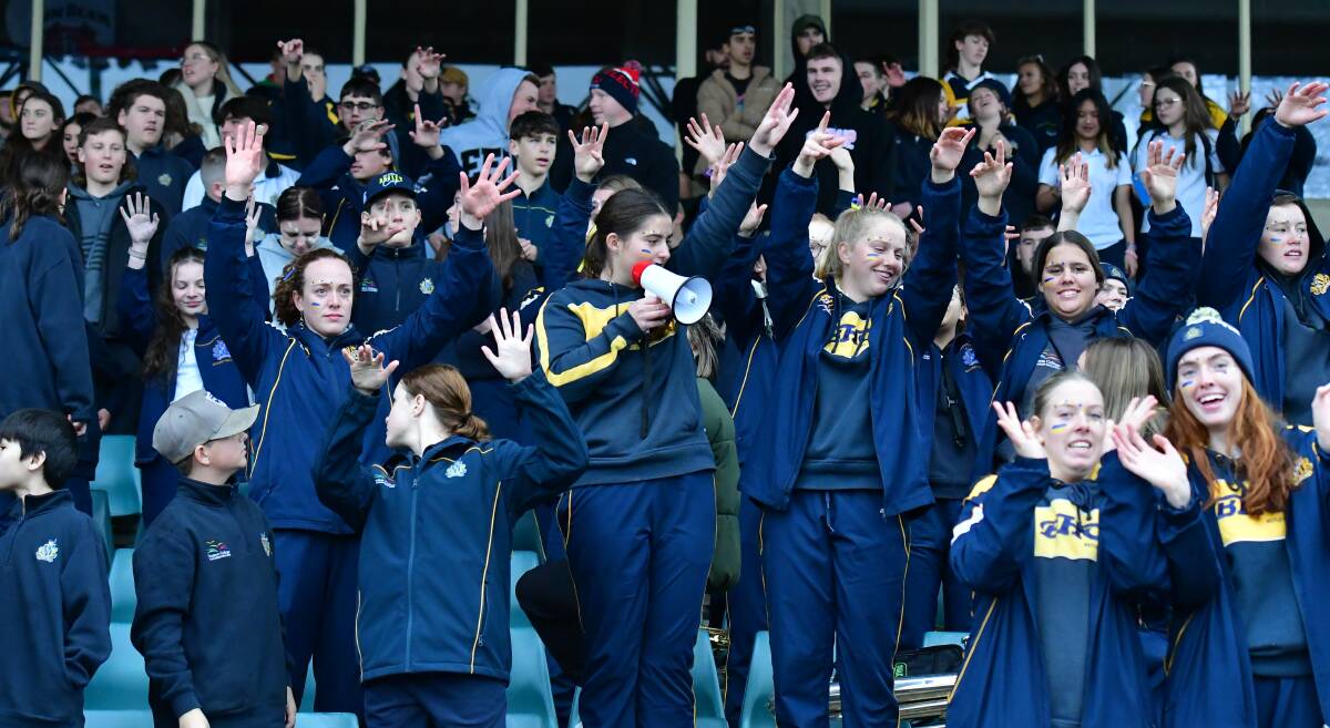 Bathurst High students throw support around their classmates in the rugby league at Carrington Park last year. Picture by Bradley Jurd