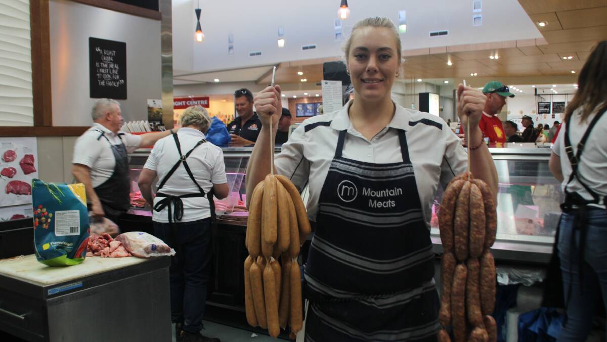 TWENTY-FOUR DIFFERENT FLAVOUS: Mountain Meats' Sarah Jackson with some of the different flavour sausages available during Race Week. Photo: BRADLEY JURD