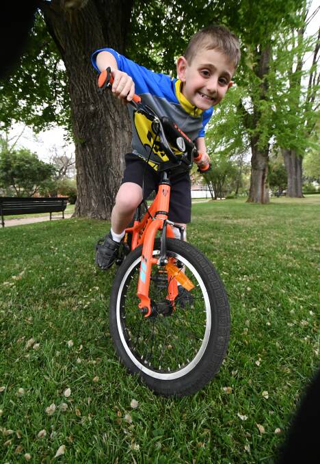 GOING FOR A RIDE: Cancer survivor six-year-old Brody Miller is an entrant in the cancer fundraiser Great Cycle Challenge. Photo: CHRIS SEABROOK 101619cbrody1