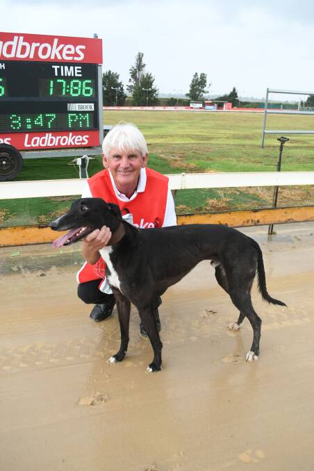 SUCCESS: Wimbledon's Michael Maney, husband of owner Lynn, with greyhound Be Harvey. The winning dog is named after former North Melbourne small forward Brent Harvey. Photo: CHRIS SEABROOK 031819cdogs2