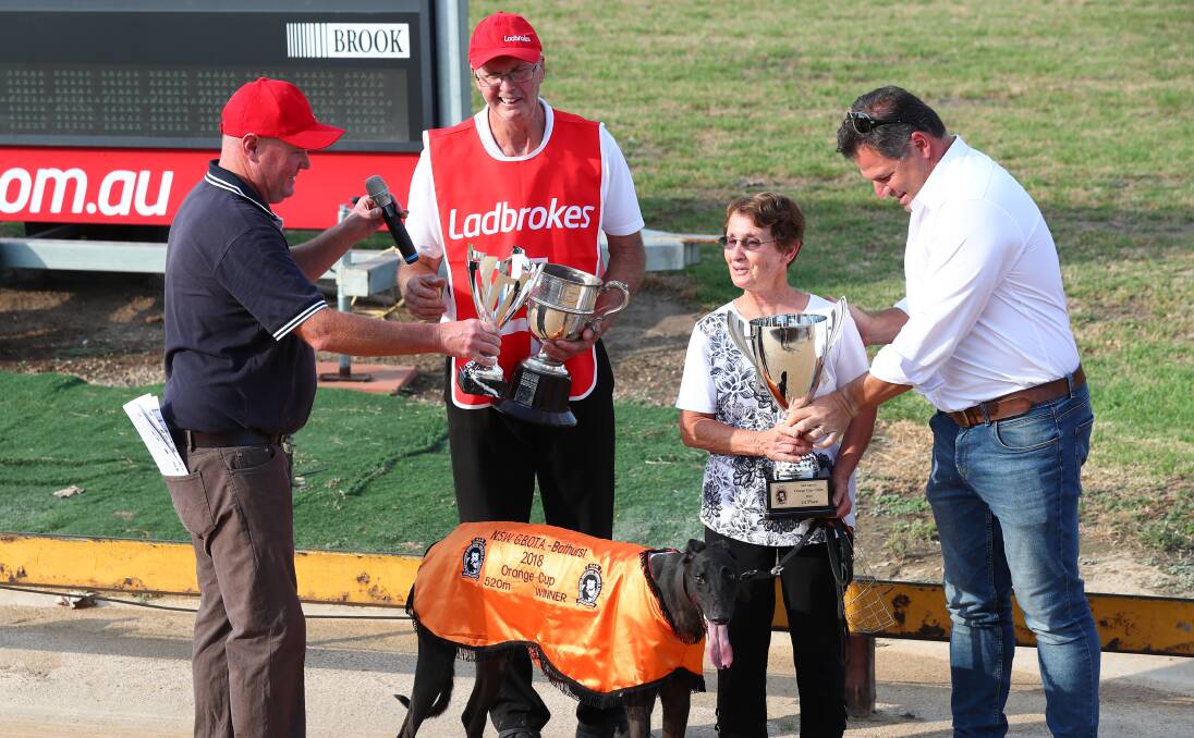 LEFT TO RIGHT: Bathurst Greyhound Racing Club racing manager Jason Lyne, 2018 Orange Cup winning trainer Paul Braddon and his wife Pam, Orange member Phil Donato and 2018 winning greyhound Falcon's Fury. Photo: PHIL BLATCH