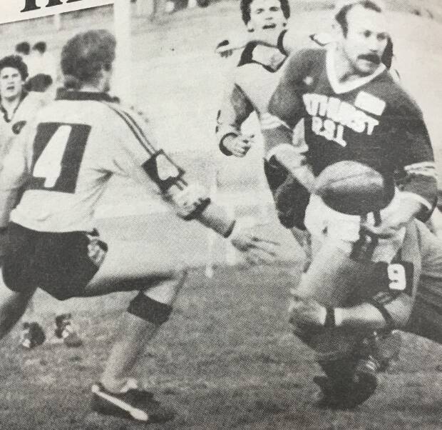 Lithgow Workmen's Club second row Mal Fitzpatrick takes the legs from under the legs of St Pat's captain-coach Glen Boatswain during a match in the 1980s. 