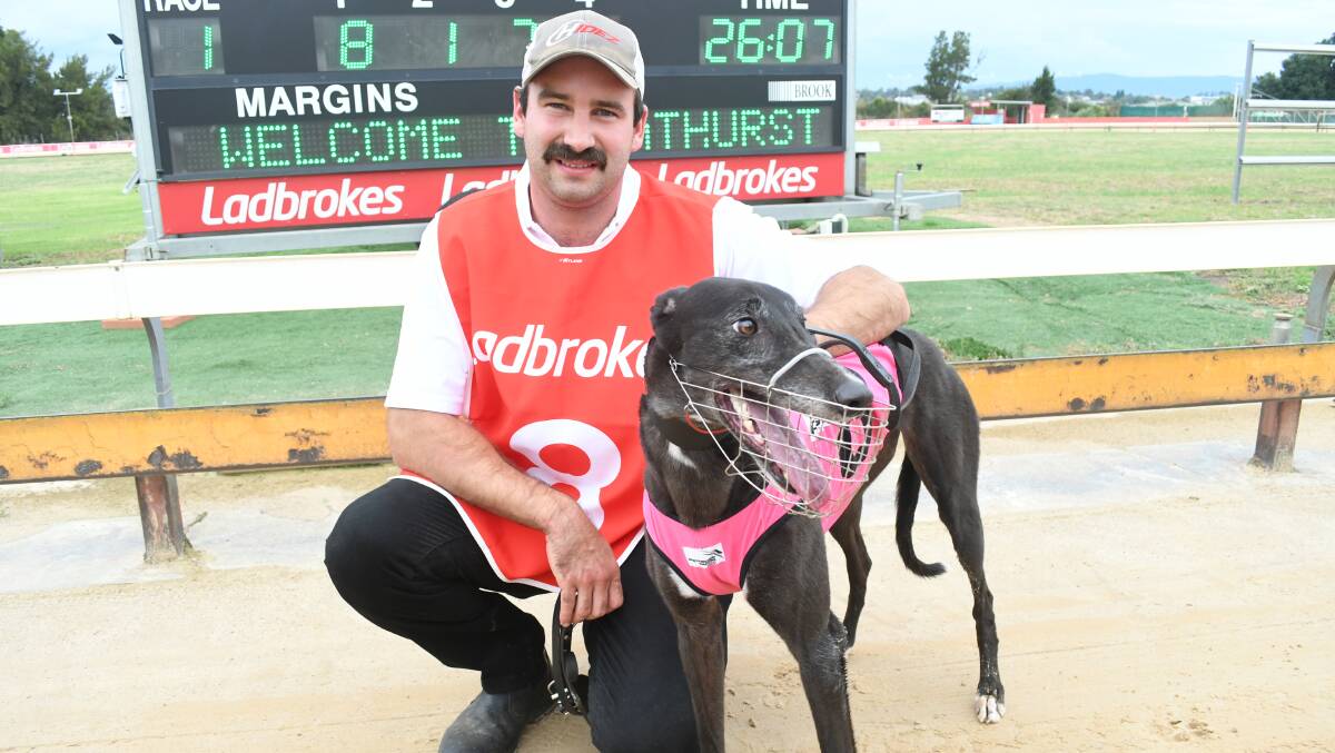 WINNER: Goulburn trainer Aaron Williams with his winning greyhound Manny Mac at Kennerson Park on Friday. Photo: CHRIS SEABROOK 012119cdogs2