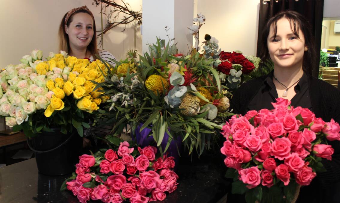 VALENTINE'S DAY RUSH: Ivory Rose Botanicals owner Maddie Veitch and Karlee Funnell preparing for a busy day on Valentine's Day. Photo: BRADLEY JURD