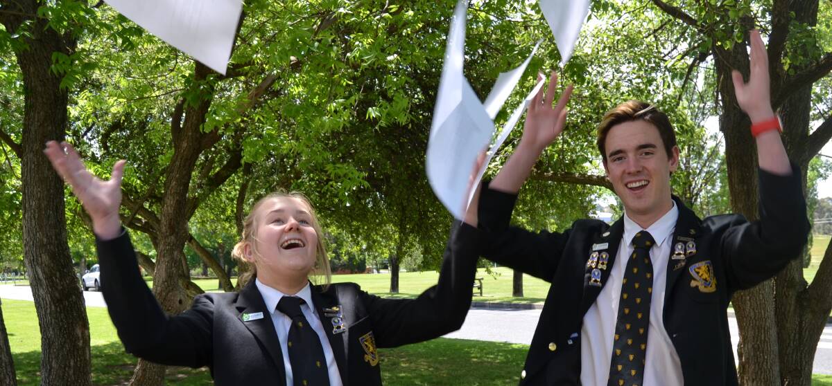 IT'S ALL OVER: The Scots School Drama students Holly Proctor and Josh Morris celebrate the end of their Higher School Certificate exams on Friday. Photo: BRADLEY JURD