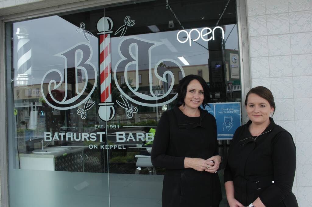 MILESTONE: Bathurst Barbers owner Sam Peacock and barber Ashley Patrick. The barbers celebrated 30 years earlier in the year. Photo: BRADLEY JURD