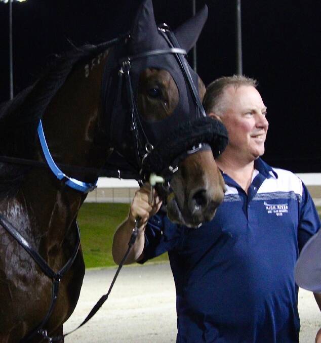 WINNER: Anthony Butt pictured with Elite Stride after his record breaking result at the Bathurst Paceway on Friday night. Photo: AMY REES
