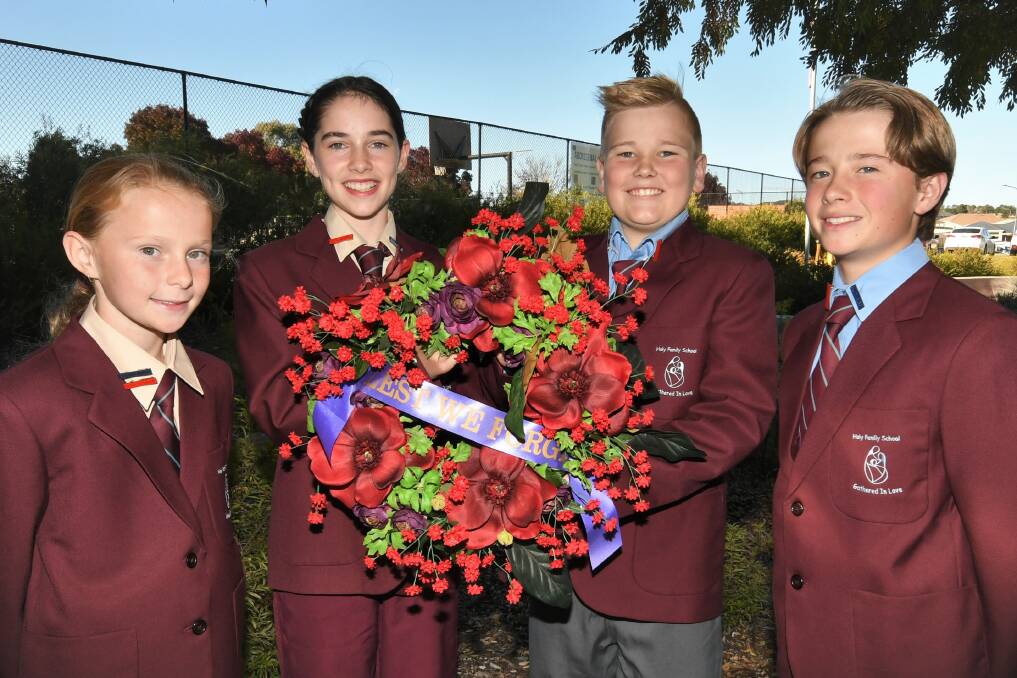 WREATH: Holy Family captains Isabelle, Georgina, Charlie and Jack will lay a wreath at the Carillon on Friday. Photo: CHRIS SEABROOK