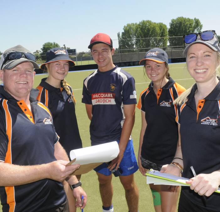 HARD WORK: WRAS head coach Shane Conroy, Tirah Jarvis, Tyler Willott, Anna Cartwright and WRAS executive officer Candice Boggs during a break at the squad's training day. Photo: CHRIS SEABROOK 112716choky