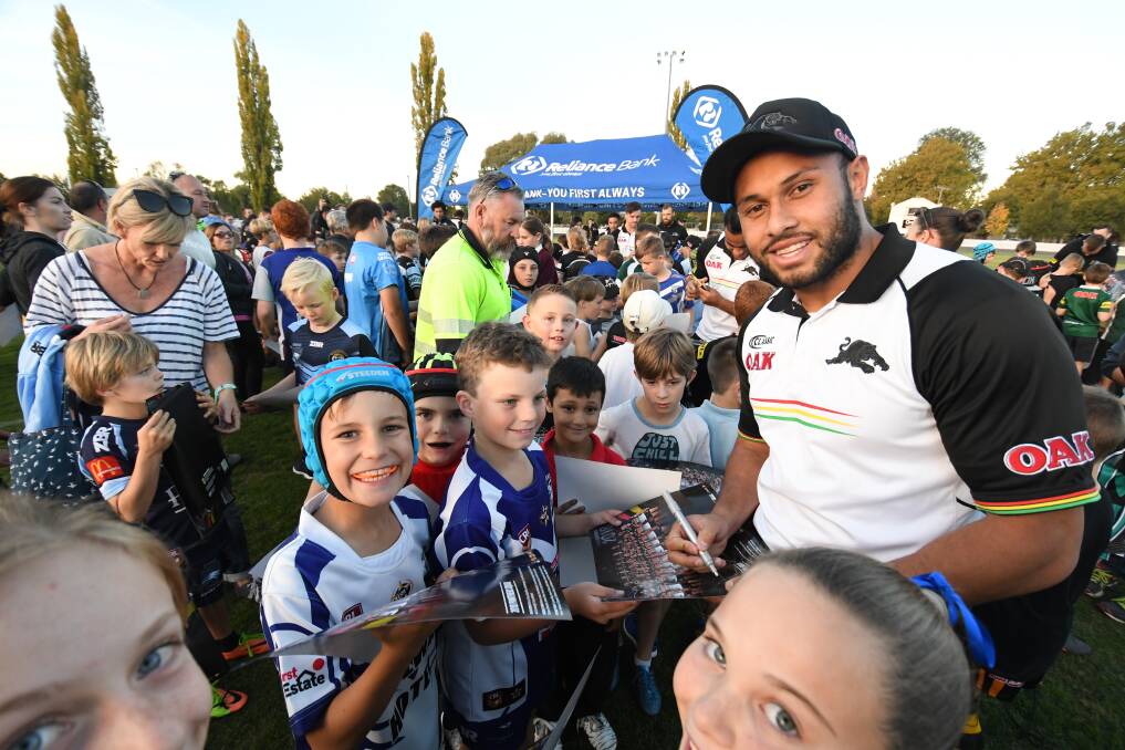 MEET AND GREET: Penrith Panthers' new recruit Tyrone Phillips with juniors and fans at Bathurst Sportsground on Tuesday. 