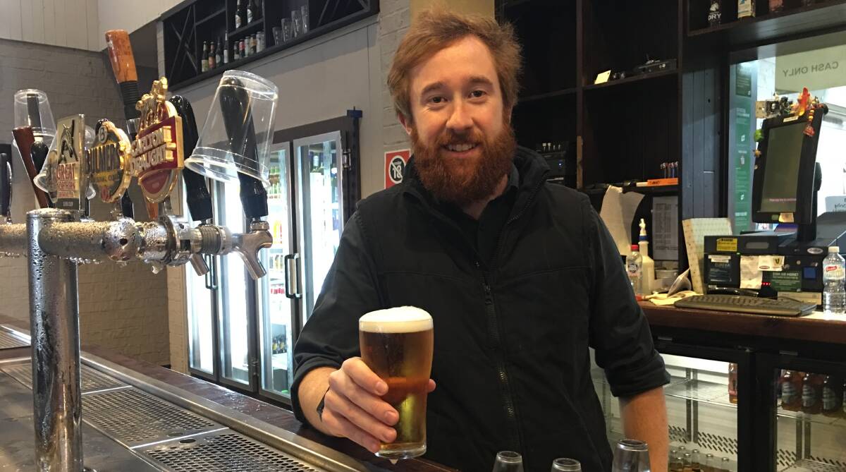 WAIT IS OVER: Paddy's Hotel manager Luke Mulligan pulls up a beer on Monday, as restrictions are eased. Photo: BRADLEY JURD