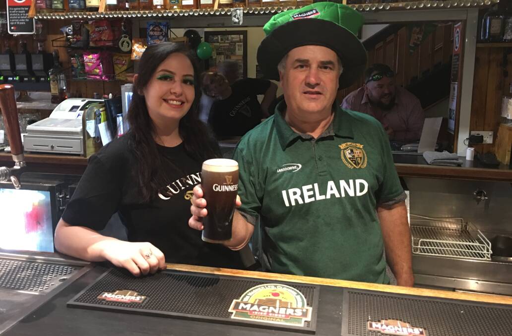 IRELAND'S BIG DAY: Jack Duggans Irish Pub bartender Felicity McKellar and publican Glyn Daunt celebrate St Patrick's Day on Sunday, March 17. Photo: BRADLEY JURD