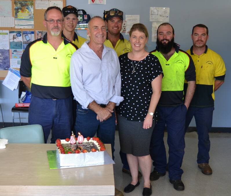 LONG SERVICE: Terry Morgan (in blue shirt) celebrated his 50th work anniversary on Tuesday, with colleagues at the Bathurst Regional Council Works Depot. Photo: BRADLEY JURD