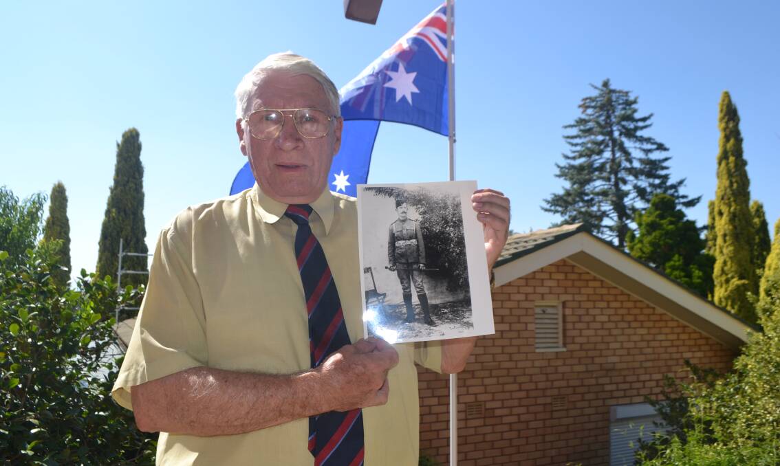 HISTORY'S PAGE: Bathurst war historian Denis Chamberlain with a photo of Peter Handcock. Handcock was executed for war crimes in 1902 during the Boer War - a decision that remains controversial to this day. Photo: BRADLEY JURD