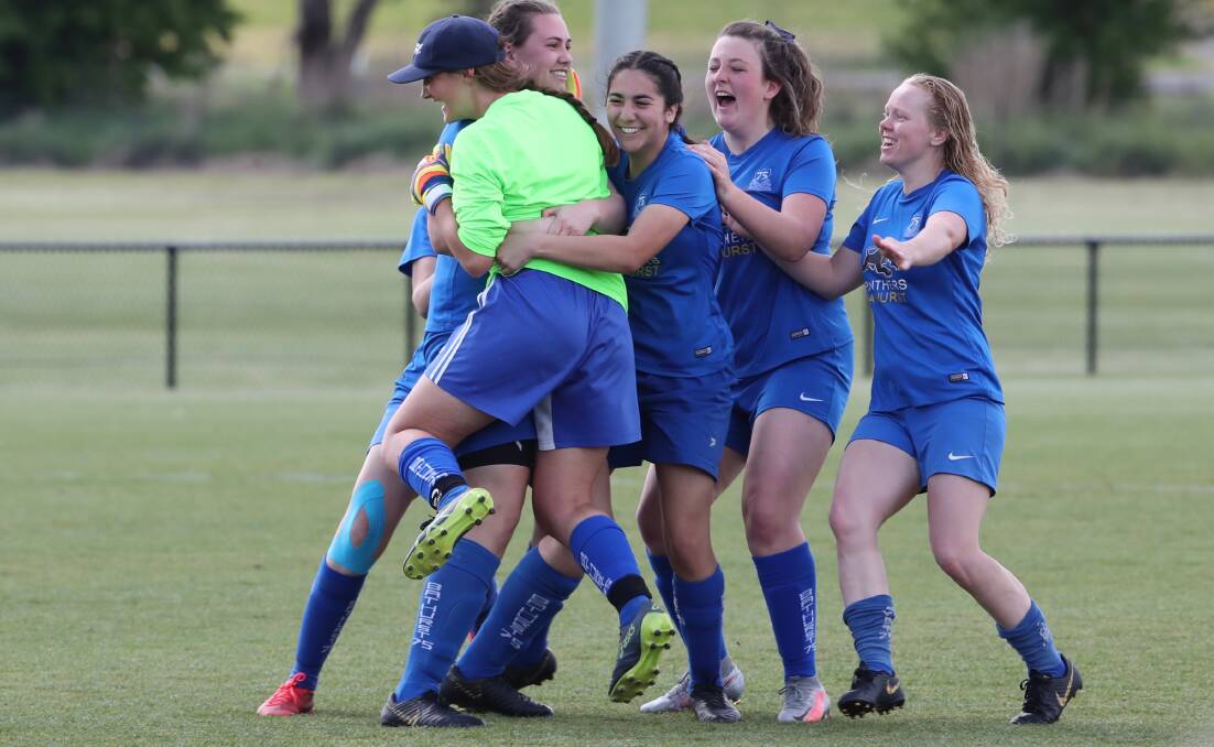 WIN: Bathurst '75 Blue celebrate its penalty shootout win over Abercrombie. Photo: PHIL BLATCH