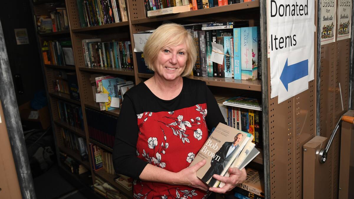 ON SALE: Bathurst Library manager Patou Clerc getting ready for the book sale on Friday and Saturday. Photo: CHRIS SEABROOK 052118cbooks1a