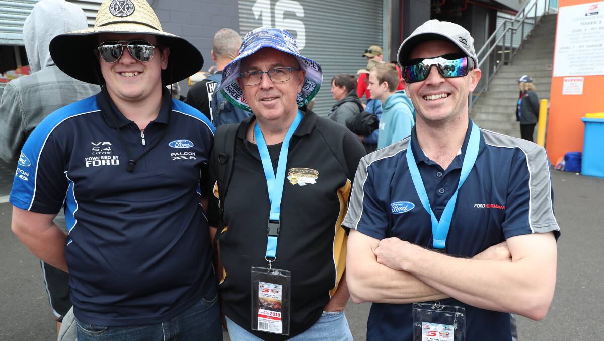 FALCON FAREWELL: Ford fans Justin and John Rychlik, with Chris Gorton. They shared their thoughts on the end of an era for the Ford Falcon. Photo: PHIL BLATCH