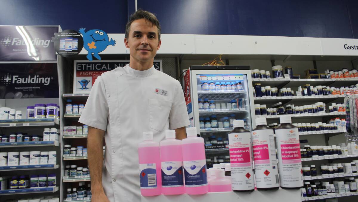 PANIC: John Matthews and Co pharmacist Marcus Heiner, with the remaining sanitiser products on Wednesday afternoon. Photo: BRADLEY JURD