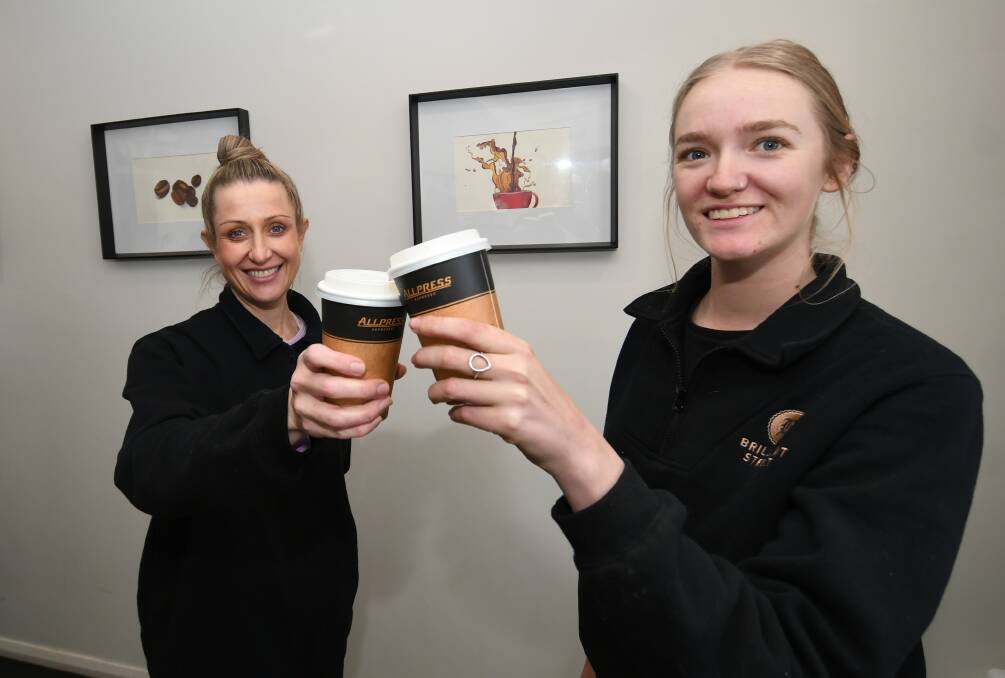 WINNERS: Brilliant Street Cafe baristas Angela Smith and Erika Lindsay toasting to the cafe's win. Photo: CHRIS SEABROOK 071320coffee1