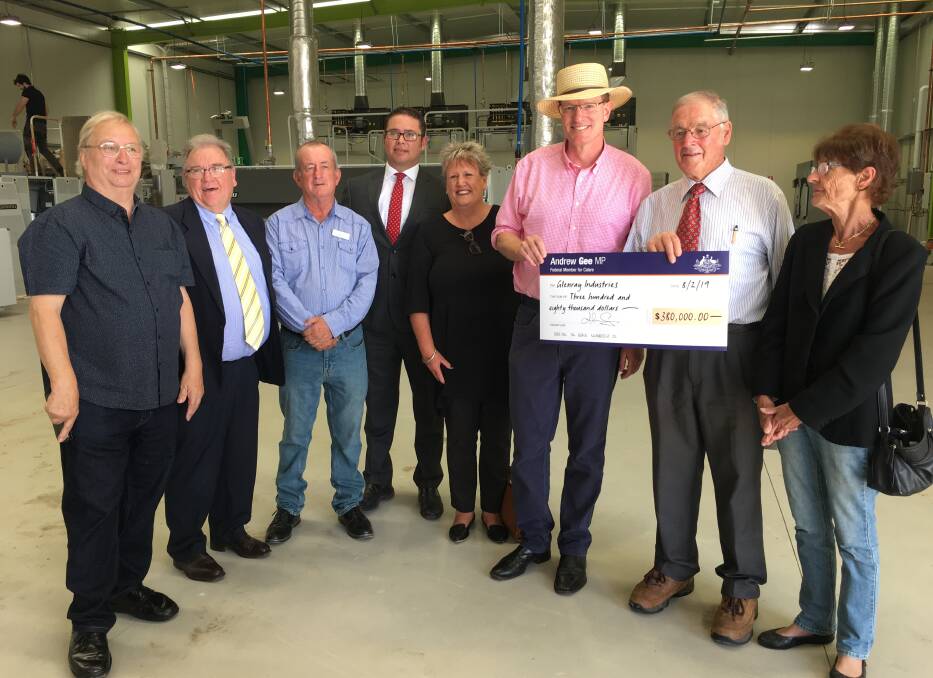 FUNDING: Federal Member for Calare Andrew Gee presents a check of $380,000 to Glenray Industries on Friday morning. Photo: BRADLEY JURD